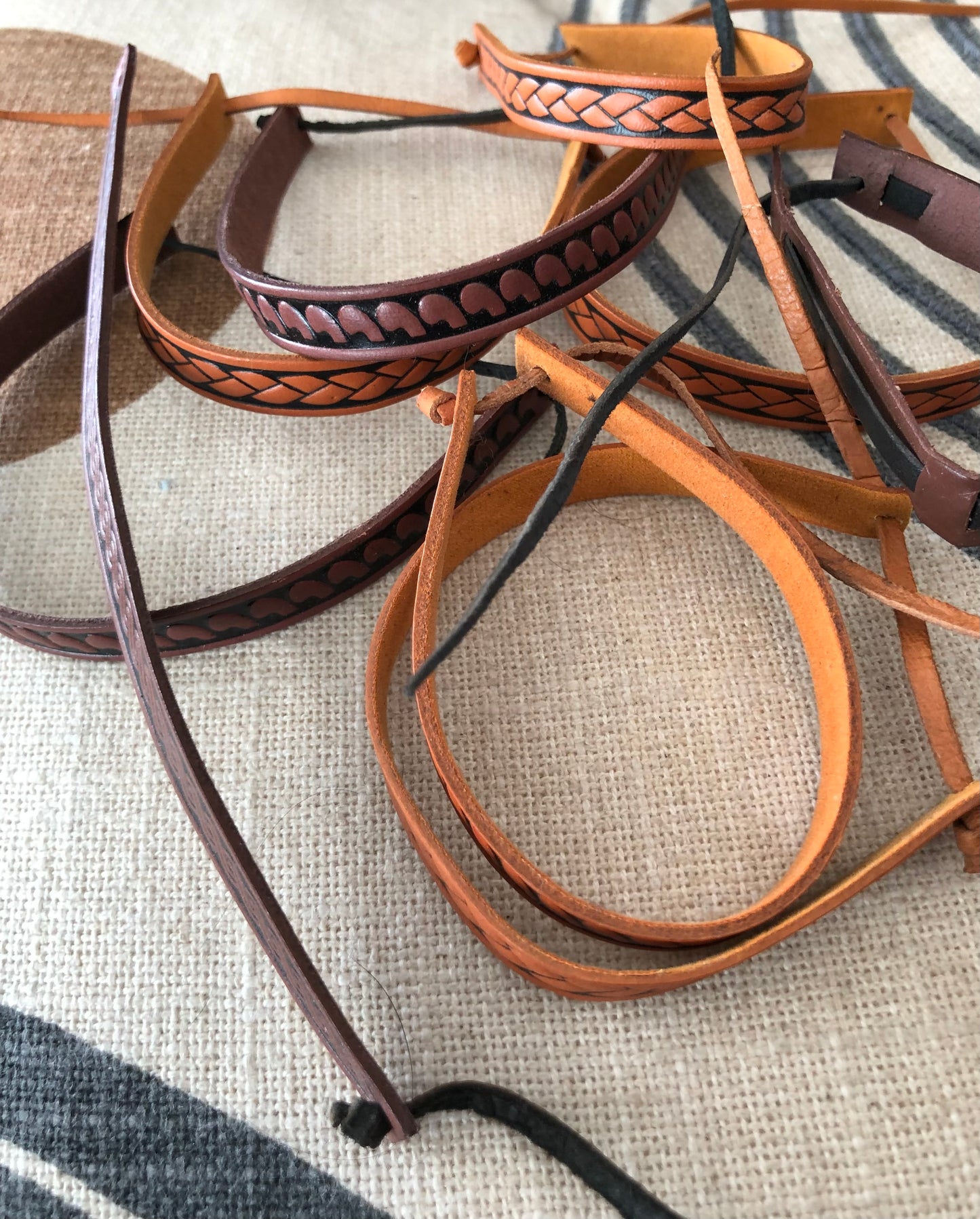 Two leather wristbands.