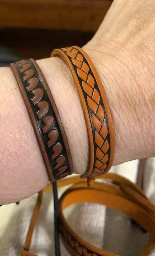 Two leather wristbands.