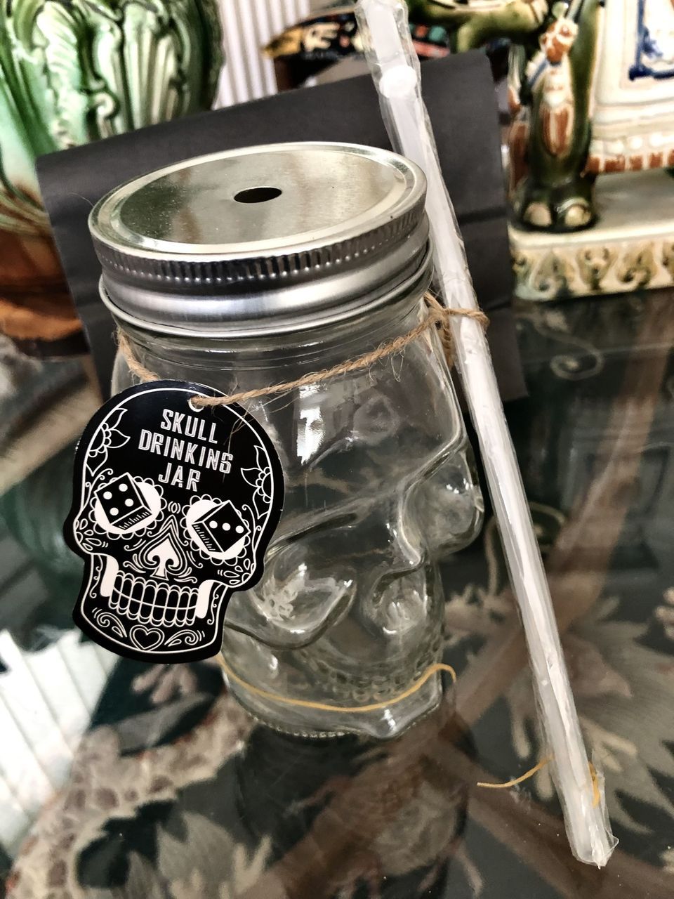 Three glass skull drinking jars.