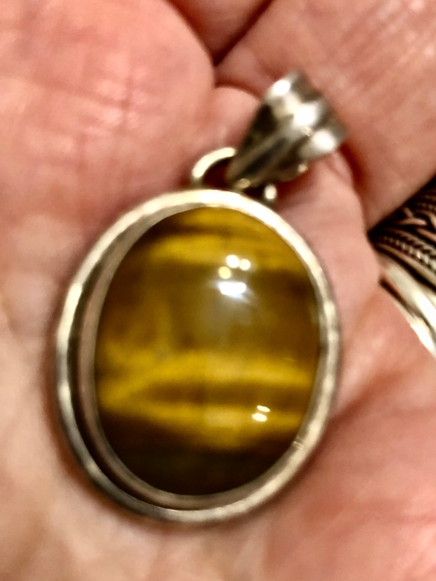 Tiger's eye and silver pendant