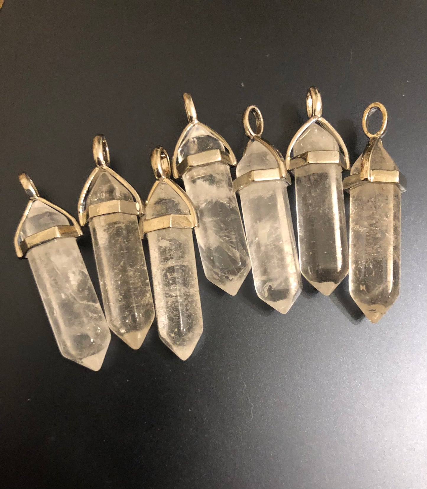 Clear quartz points pendants.