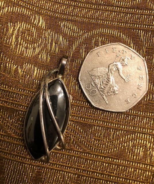 Hematite and silver pendant.